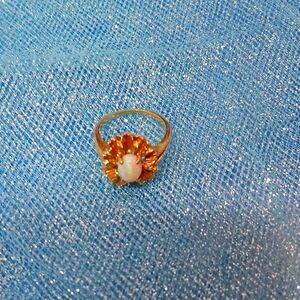 Gold ring with an opal stone